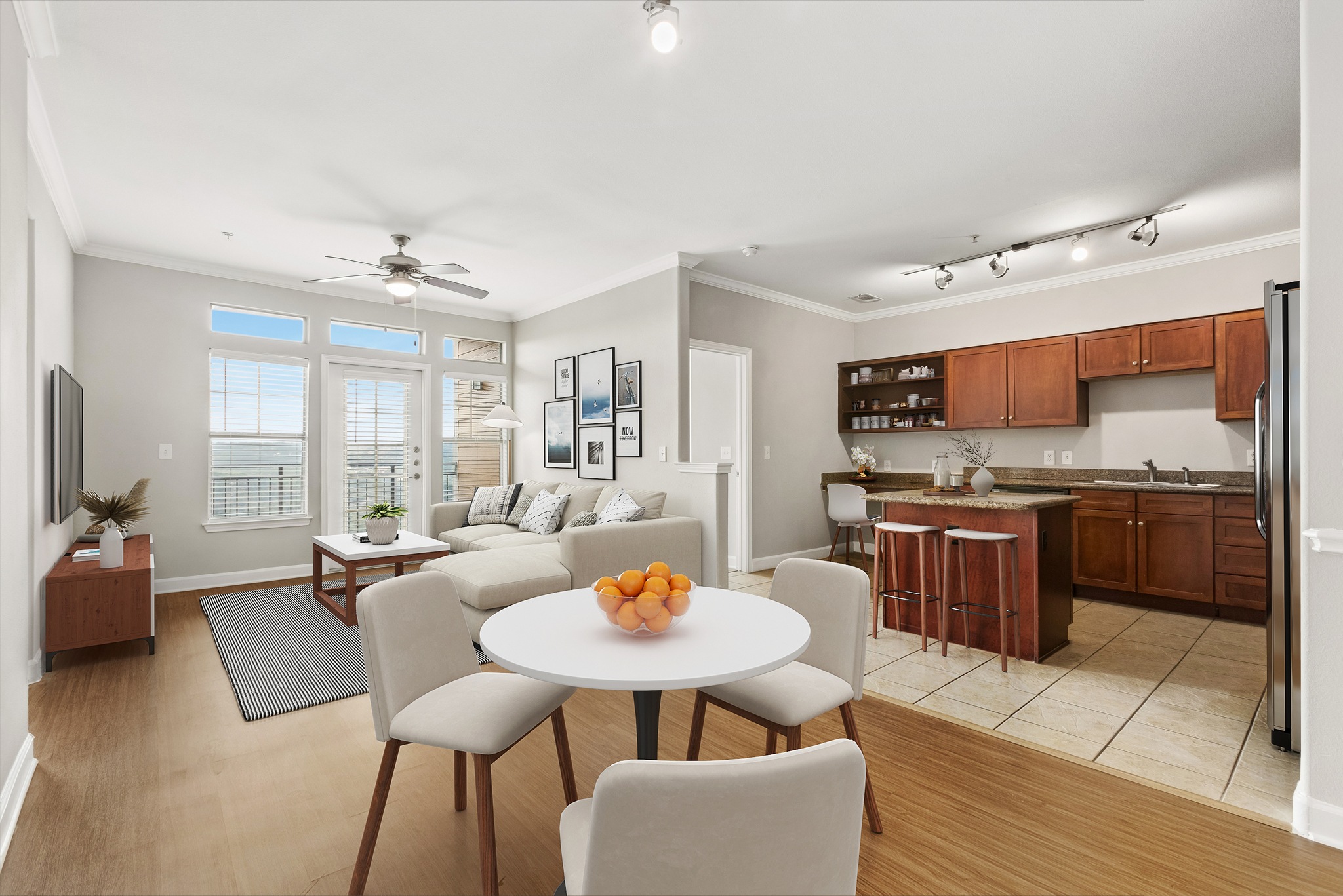 A modern kitchen with a dining table set for four.